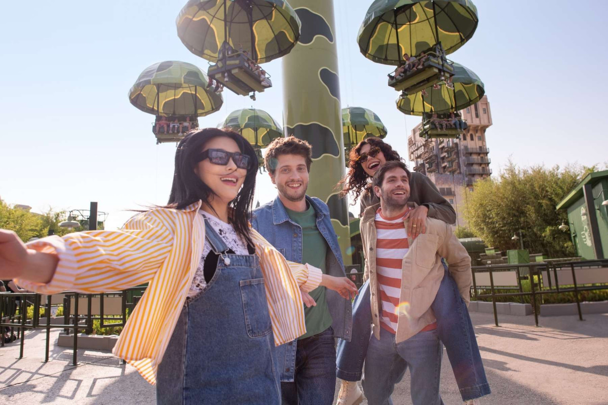 Guests at Attraction in Disneyland Park