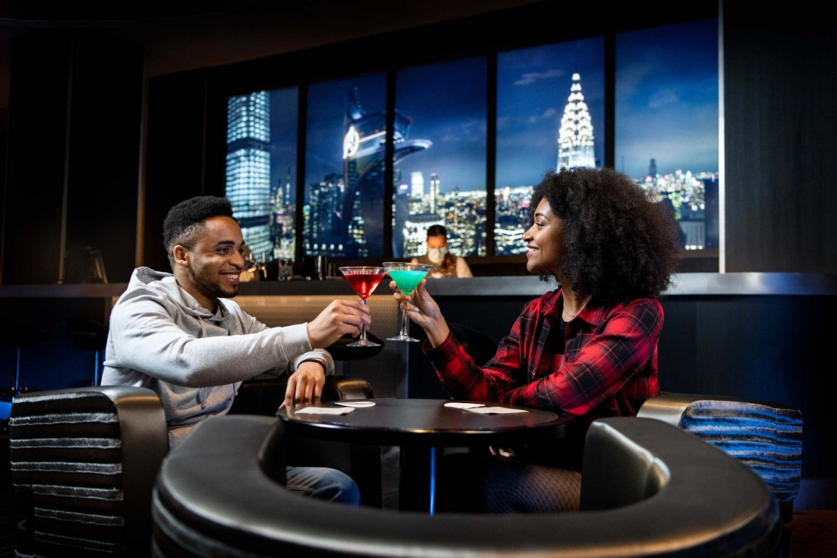 Guests at Bar in New York Art of Marvel Hotel